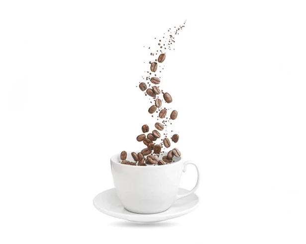 Coffee beans falling into a cup