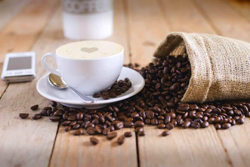 Coffee cup and beans